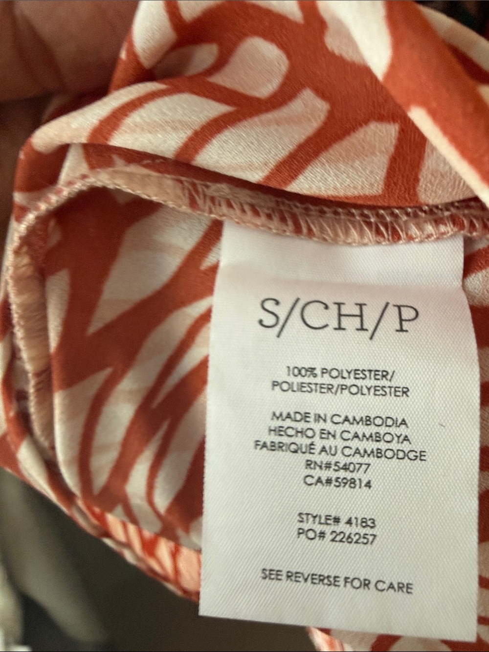 CAbi Sleeveless Collared V-Neck Top in burnt orange and white/cream - Picture 6 of 6